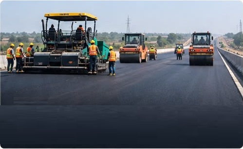 Highway construction with paving and roadwork equipment